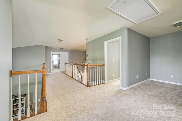 7737 Pleasant Valley Dr, Harrisburg, NC 28075 - hall with attic access, an upstairs landing, and carpet floors