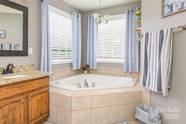 7737 Pleasant Valley Dr, Harrisburg, NC 28075 - full bath with vanity, a bath, and healthy amount of natural light