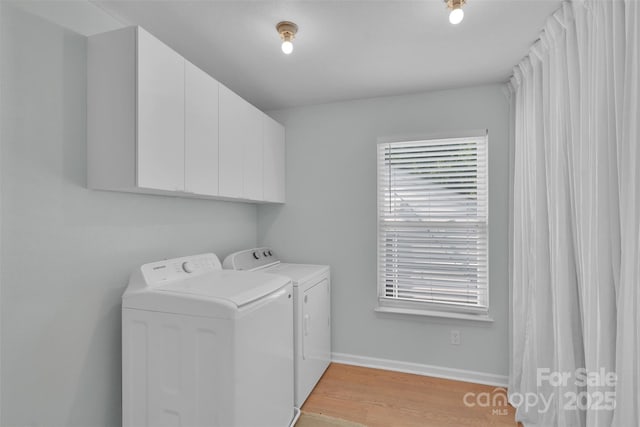 2926 Royal Fern Ln, Charlotte, NC 28215 - laundry area with washer and dryer, cabinet space, and light wood finished floors