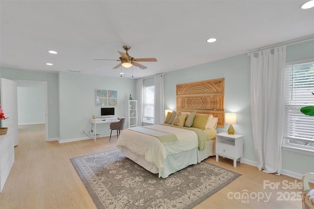 2926 Royal Fern Ln, Charlotte, NC 28215 - bedroom with multiple windows, light wood-type flooring, a ceiling fan, and recessed lighting