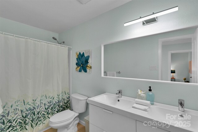 2926 Royal Fern Ln, Charlotte, NC 28215 - bathroom with vanity and a shower with shower curtain