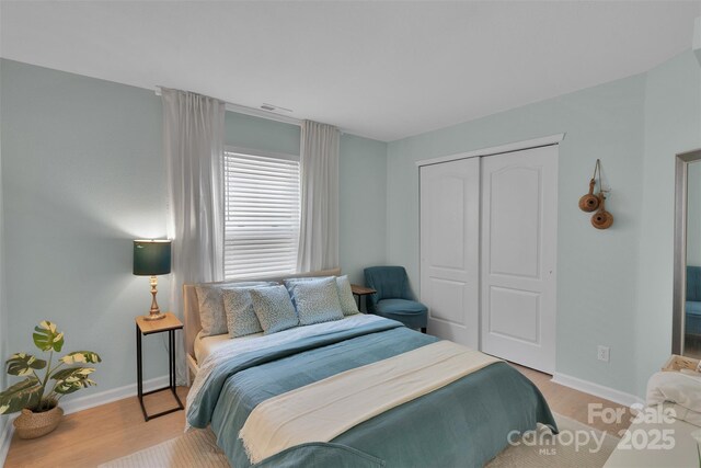 2926 Royal Fern Ln, Charlotte, NC 28215 - bedroom featuring a closet and light wood finished floors