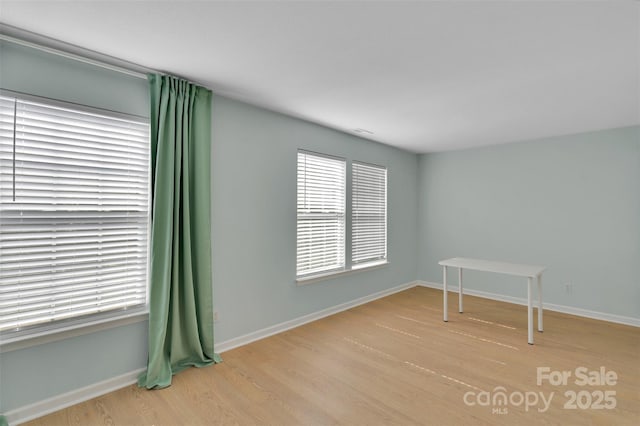 2926 Royal Fern Ln, Charlotte, NC 28215 - empty room with wood finished floors and plenty of natural light