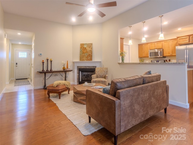 29 Kaylor Dr, Arden, NC 28704 - living area featuring a ceiling fan, light wood-type flooring, a glass covered fireplace, and recessed lighting