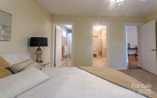 29 Kaylor Dr, Arden, NC 28704 - carpeted bedroom featuring baseboards and ensuite bath