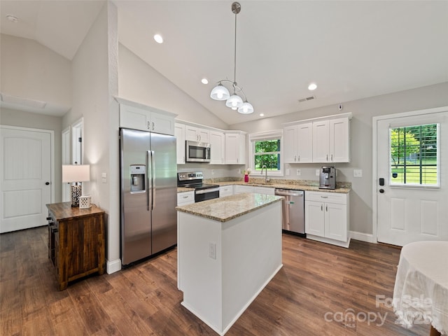 101 Meadowbrook Dr, Franklin, NC 28734 - kitchen with appliances with stainless steel finishes, white cabinets, a kitchen island, light stone countertops, and dark wood-style flooring