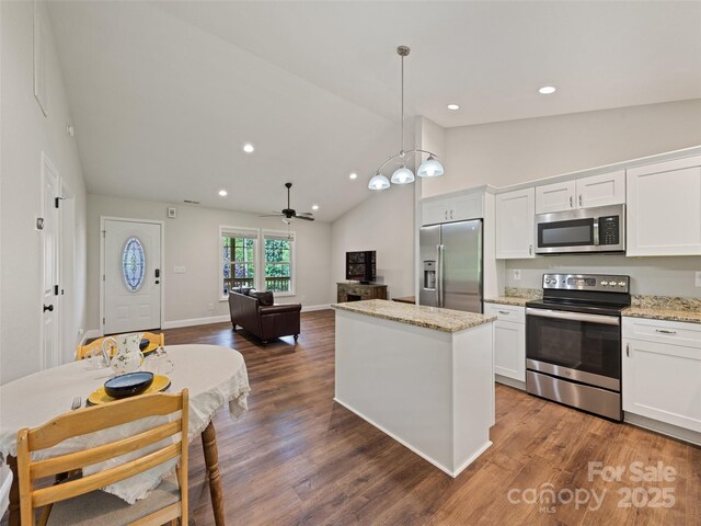 101 Meadowbrook Dr, Franklin, NC 28734 - kitchen featuring stainless steel appliances, white cabinets, a center island, high vaulted ceiling, and dark wood finished floors