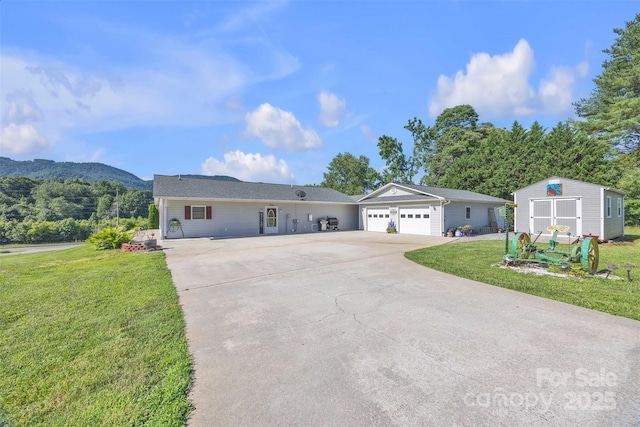 5158 Jenkins Rd, Morganton, NC 28655 - ranch-style home with driveway, a front yard, an outbuilding, a garage, and a mountain view