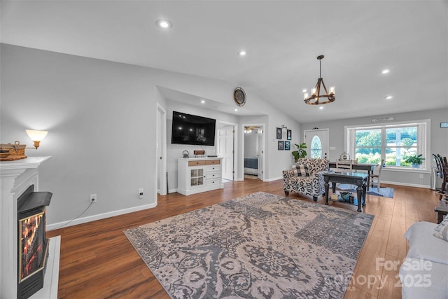 5158 Jenkins Rd, Morganton, NC 28655 - living room with wood finished floors, a chandelier, lofted ceiling, recessed lighting, and a glass covered fireplace