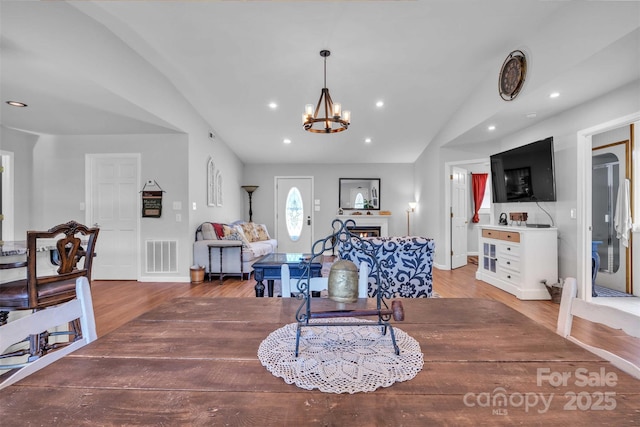 5158 Jenkins Rd, Morganton, NC 28655 - dining room with light wood-type flooring, a chandelier, lofted ceiling, and recessed lighting