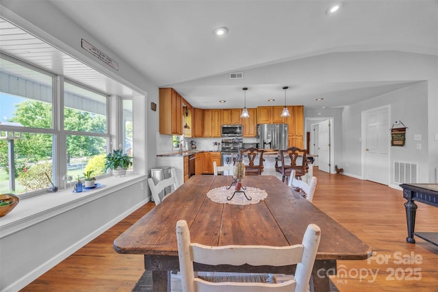 5158 Jenkins Rd, Morganton, NC 28655 - dining space featuring light wood-type flooring, recessed lighting, and lofted ceiling