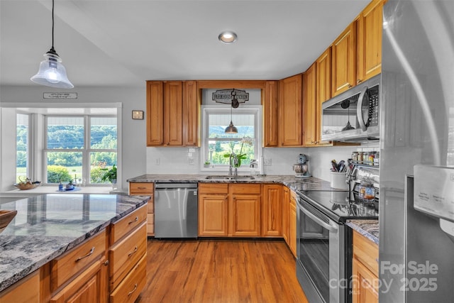 5158 Jenkins Rd, Morganton, NC 28655 - kitchen with stainless steel appliances, wood finished floors, plenty of natural light, brown cabinetry, and recessed lighting