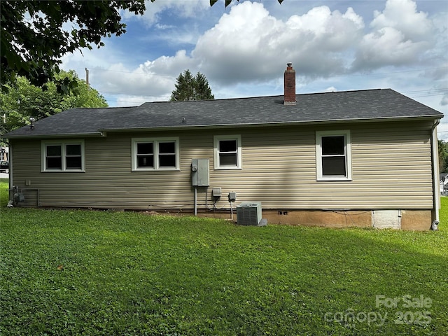 1116 Lenoir Ave SW, Lenoir, NC 28645 - rear view of house with a chimney, a yard, crawl space, and a shingled roof