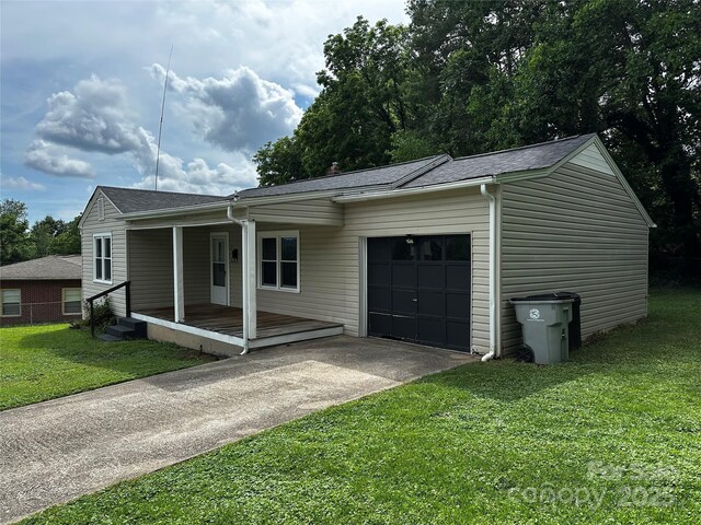1116 Lenoir Ave SW, Lenoir, NC 28645 - view of front of property with driveway, a garage, a front yard, and a porch