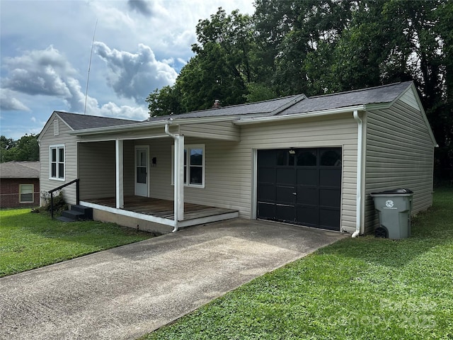 1116 Lenoir Ave SW, Lenoir, NC 28645 - ranch-style house with an attached garage, concrete driveway, a front lawn, and covered porch