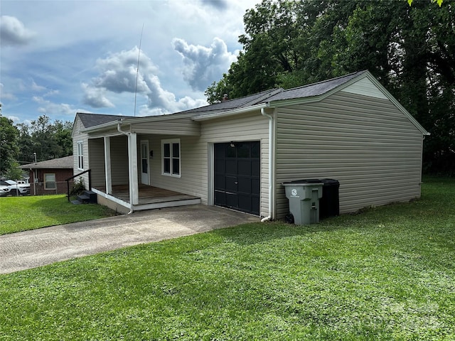 1116 Lenoir Ave SW, Lenoir, NC 28645 - view of home's exterior with driveway, covered porch, an attached garage, and a lawn