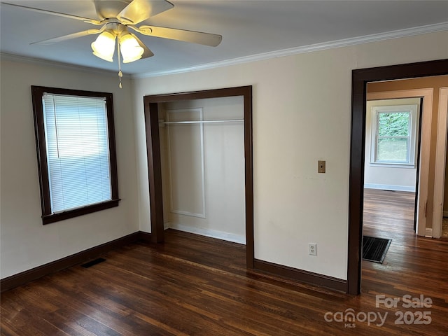 1116 Lenoir Ave SW, Lenoir, NC 28645 - unfurnished bedroom featuring wood finished floors, a closet, crown molding, and ceiling fan