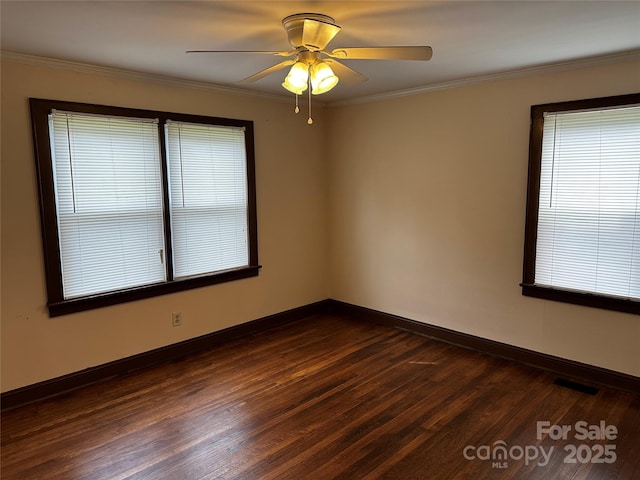 1116 Lenoir Ave SW, Lenoir, NC 28645 - empty room featuring dark wood-style flooring, ceiling fan, and crown molding