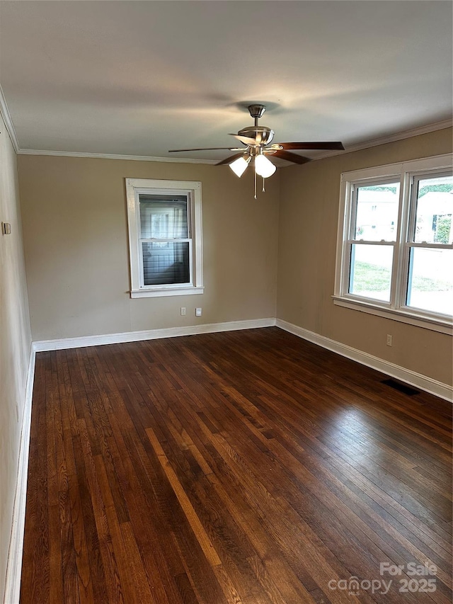 1116 Lenoir Ave SW, Lenoir, NC 28645 - spare room with dark wood finished floors, ornamental molding, and ceiling fan