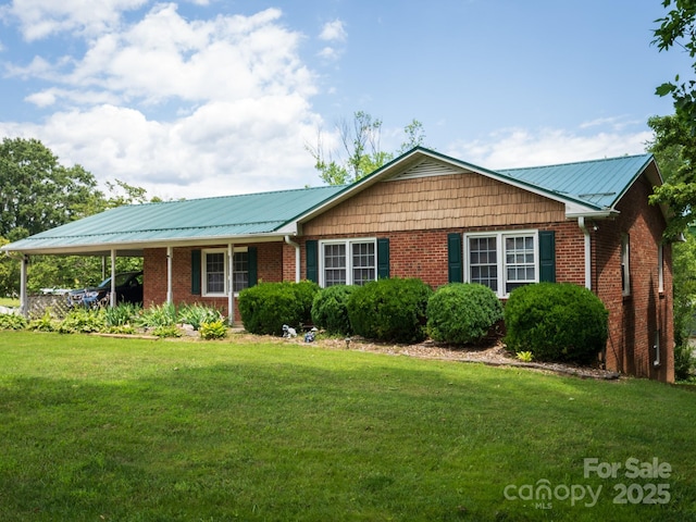 69 Katydid Dr, Marion, NC 28752 - ranch-style home with a front yard, brick siding, and a metal roof