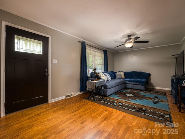 69 Katydid Dr, Marion, NC 28752 - living area with wood finished floors, crown molding, and a ceiling fan