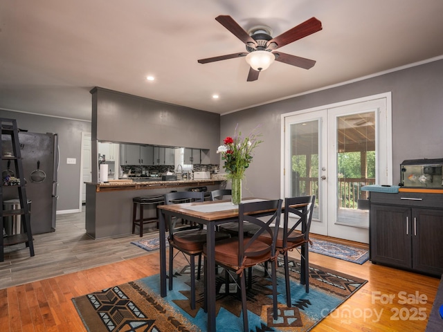 69 Katydid Dr, Marion, NC 28752 - dining space with ornamental molding, a ceiling fan, light wood-style floors, french doors, and recessed lighting