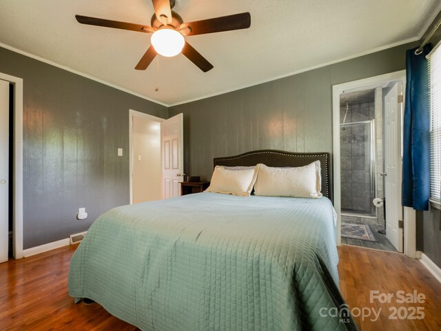 69 Katydid Dr, Marion, NC 28752 - bedroom featuring wood finished floors, crown molding, ceiling fan, and connected bathroom