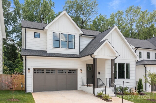 3937 Plainview Rd, Charlotte, NC 28208 - modern inspired farmhouse with board and batten siding, concrete driveway, a garage, and roof with shingles