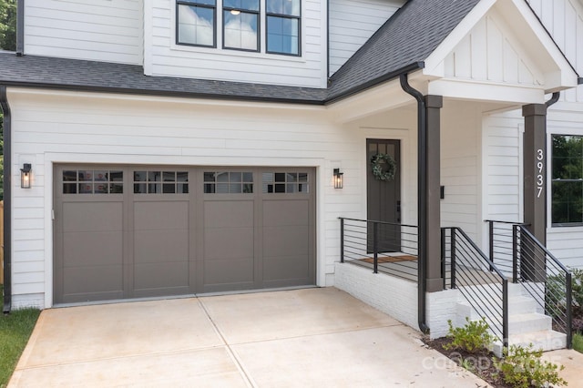 3937 Plainview Rd, Charlotte, NC 28208 - view of front of house featuring a garage, roof with shingles, concrete driveway, and board and batten siding