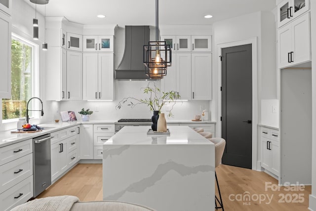 3937 Plainview Rd, Charlotte, NC 28208 - kitchen with custom exhaust hood, stainless steel dishwasher, white cabinetry, and recessed lighting