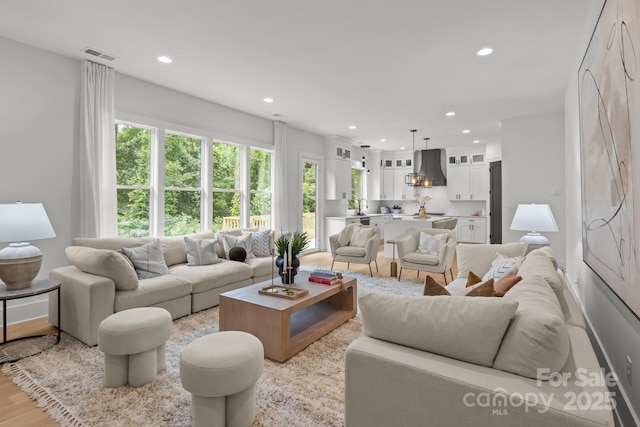 3937 Plainview Rd, Charlotte, NC 28208 - living room featuring recessed lighting and wood finished floors
