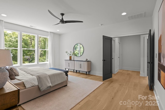 3937 Plainview Rd, Charlotte, NC 28208 - bedroom with multiple windows, light wood-style flooring, recessed lighting, and ceiling fan