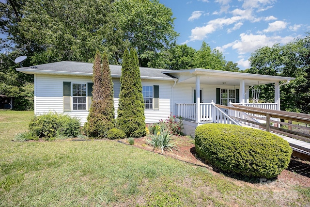 38367 Loblolly Ln, New London, NC 28127 - ranch-style home with a front yard and covered porch