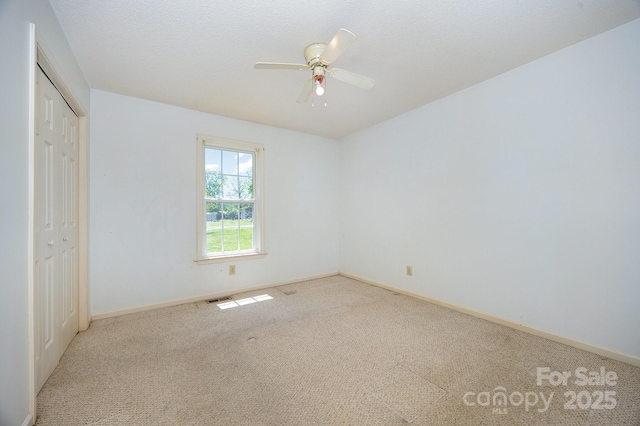 38367 Loblolly Ln, New London, NC 28127 - unfurnished bedroom featuring carpet flooring, a closet, and a ceiling fan
