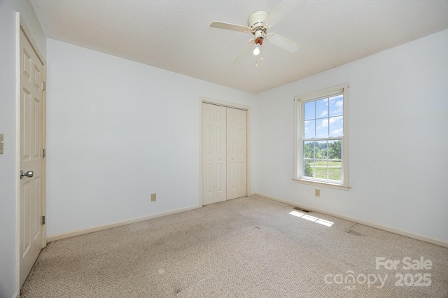 38367 Loblolly Ln, New London, NC 28127 - unfurnished bedroom with carpet, a closet, and ceiling fan
