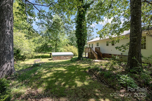 38367 Loblolly Ln, New London, NC 28127 - view of green lawn with stairs and a wooden deck