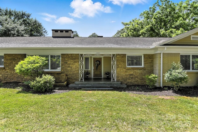 3127 N Center St, Hickory, NC 28601 - entrance to property with a yard, stone siding, a chimney, and a shingled roof