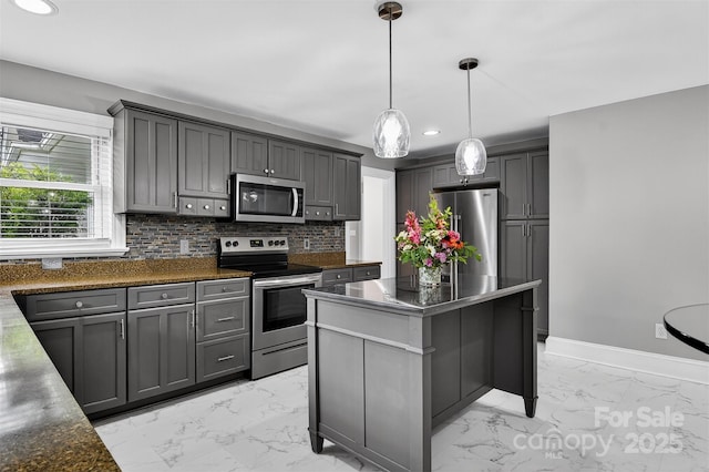 3127 N Center St, Hickory, NC 28601 - kitchen featuring appliances with stainless steel finishes, light marble finish floors, backsplash, recessed lighting, and a kitchen island