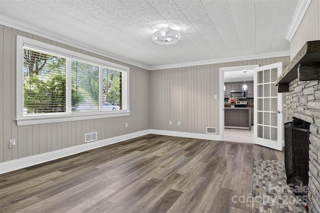 3127 N Center St, Hickory, NC 28601 - unfurnished living room featuring crown molding and wood finished floors