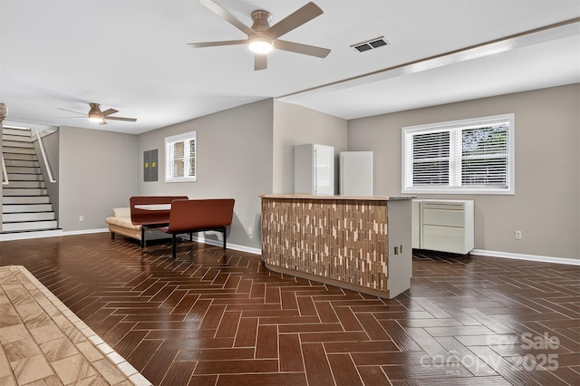 3127 N Center St, Hickory, NC 28601 - living area with a ceiling fan, stairway, and plenty of natural light