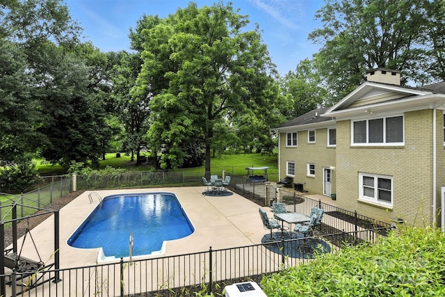 3127 N Center St, Hickory, NC 28601 - view of pool with a patio area, a fenced backyard, and view of wooded area