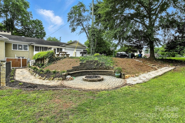 3127 N Center St, Hickory, NC 28601 - view of green lawn with an outdoor fire pit