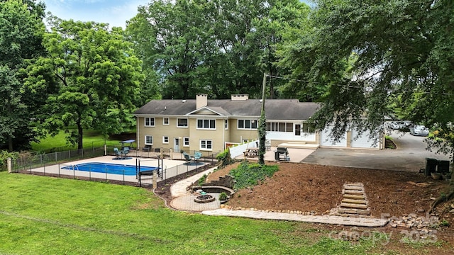 3127 N Center St, Hickory, NC 28601 - back of house with a patio, a chimney, and view of scattered trees