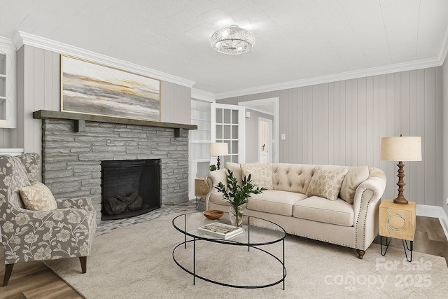 3127 N Center St, Hickory, NC 28601 - living room featuring ornamental molding, wood finished floors, a stone fireplace, and built in features
