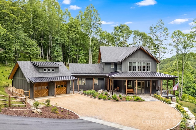 1416 E Clubhouse Rd Unit 73, Sylva, NC 28779 - view of front of house featuring a standing seam roof, a porch, a metal roof, driveway, and a shingled roof