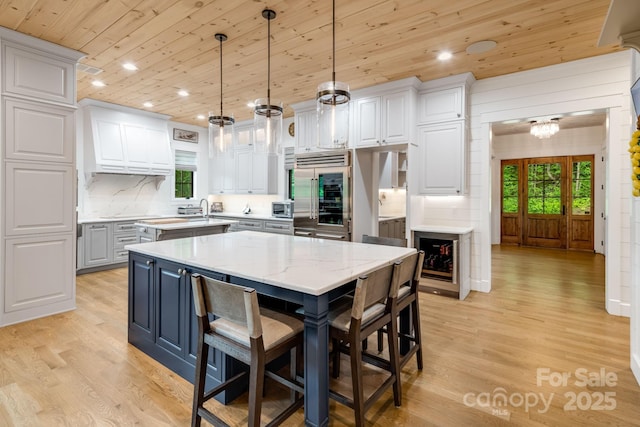 1416 E Clubhouse Rd Unit 73, Sylva, NC 28779 - kitchen featuring wooden ceiling, a center island, appliances with stainless steel finishes, light wood finished floors, and recessed lighting