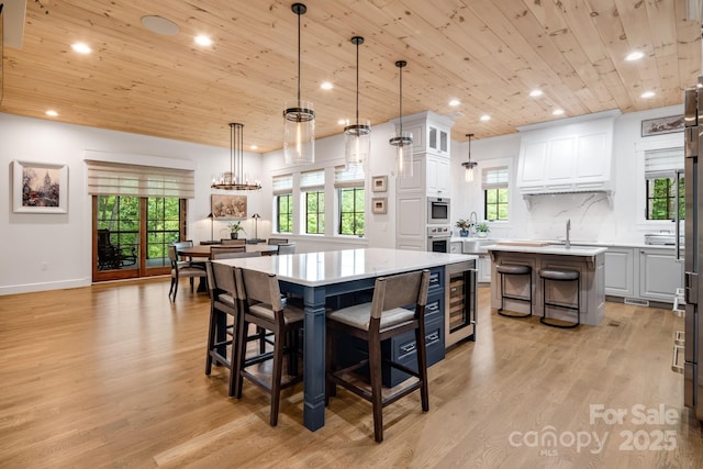 1416 E Clubhouse Rd Unit 73, Sylva, NC 28779 - dining room featuring wooden ceiling, wine cooler, recessed lighting, light wood finished floors, and healthy amount of natural light