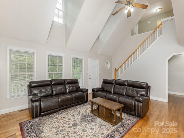 30 Collenwood Rd, Arden, NC 28704 - living area featuring high vaulted ceiling, ceiling fan, wood finished floors, stairs, and arched walkways