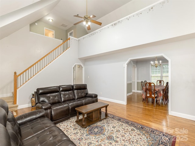30 Collenwood Rd, Arden, NC 28704 - living room with stairs, a chandelier, wood finished floors, a high ceiling, and ceiling fan