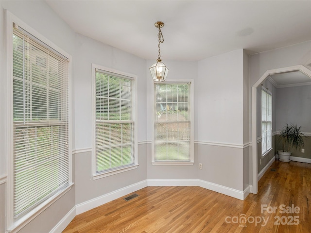 30 Collenwood Rd, Arden, NC 28704 - unfurnished dining area featuring light wood-type flooring and arched walkways